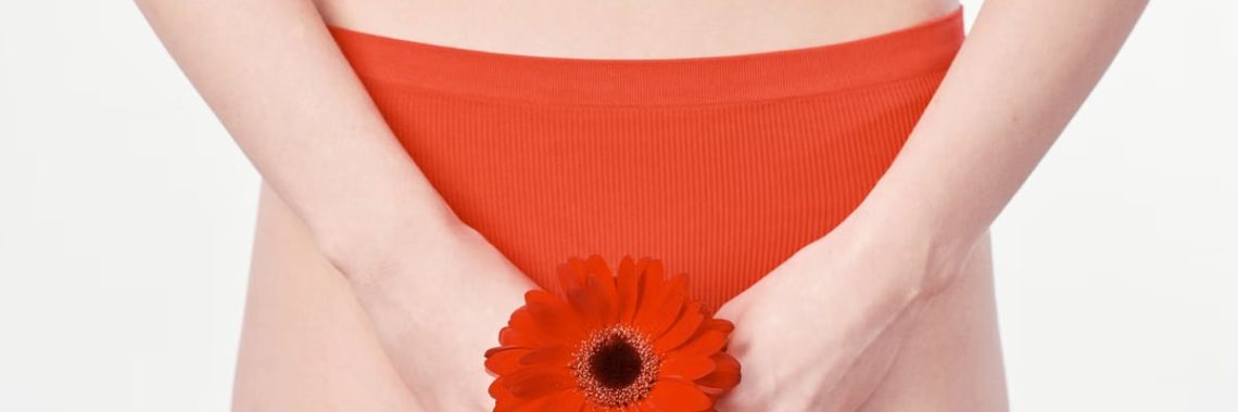 Close-up of a woman holding a flower, emphasizing health, body image, and femininity.